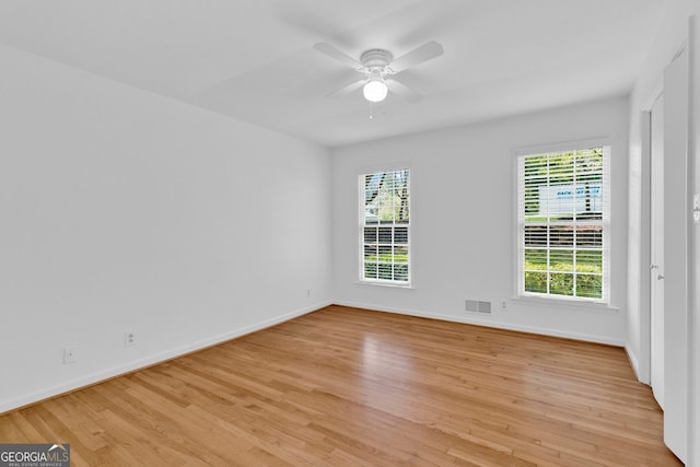 1590 Sunnybrook Farm Rd, Atlanta, GA 30350 - empty room with light wood-type flooring and a ceiling fan