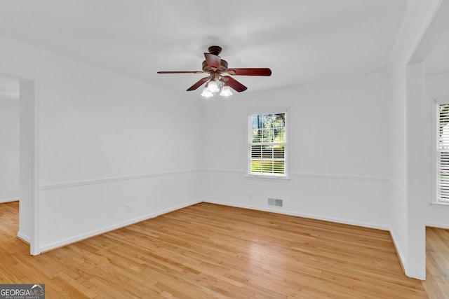 1590 Sunnybrook Farm Rd, Atlanta, GA 30350 - spare room with ceiling fan, light wood-style flooring, and crown molding