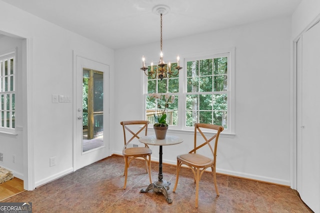 1590 Sunnybrook Farm Rd, Atlanta, GA 30350 - dining area featuring a chandelier and baseboards