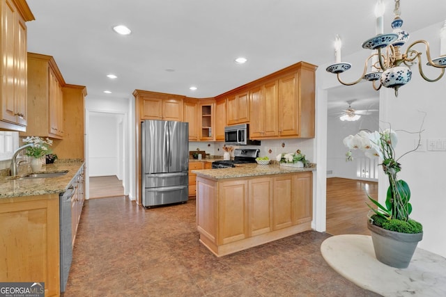 1590 Sunnybrook Farm Rd, Atlanta, GA 30350 - kitchen featuring appliances with stainless steel finishes, a peninsula, recessed lighting, light stone countertops, and a ceiling fan