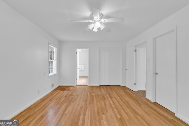 1590 Sunnybrook Farm Rd, Atlanta, GA 30350 - unfurnished bedroom featuring light wood-type flooring and a ceiling fan