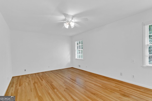 1590 Sunnybrook Farm Rd, Atlanta, GA 30350 - empty room featuring light wood-style flooring, healthy amount of natural light, and a ceiling fan