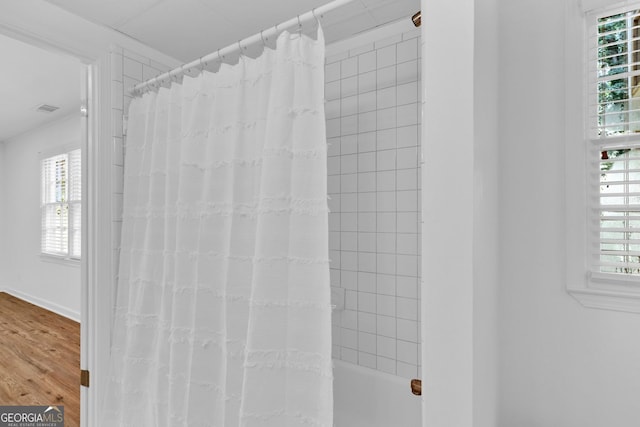 1590 Sunnybrook Farm Rd, Atlanta, GA 30350 - bathroom featuring wood finished floors and shower / bath combination with curtain