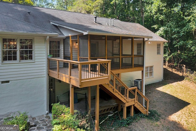 1590 Sunnybrook Farm Rd, Atlanta, GA 30350 - back of property with stairway, a shingled roof, a deck, and a sunroom