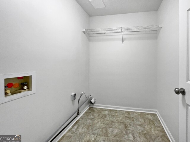 5021 Rodrick Trce, Marietta, GA 30066 - laundry area featuring hookup for a washing machine and baseboards