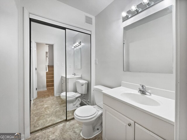 5021 Rodrick Trce, Marietta, GA 30066 - bathroom featuring vanity and toilet