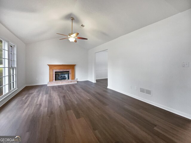 5021 Rodrick Trce, Marietta, GA 30066 - unfurnished living room with a ceiling fan, dark wood-style flooring, a brick fireplace, and lofted ceiling