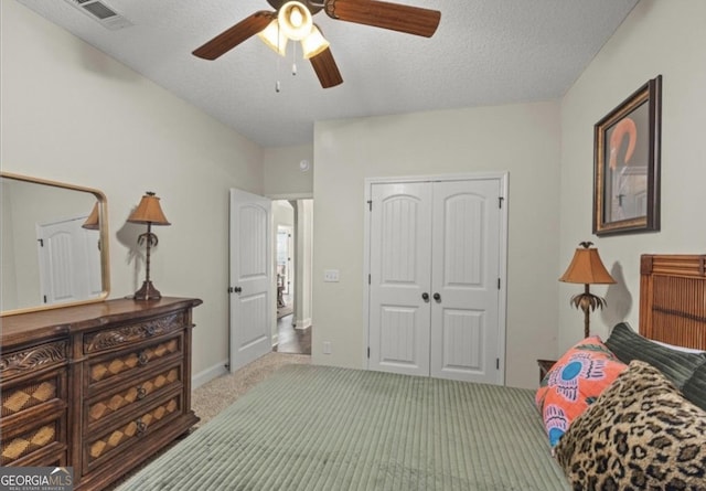 25 Port Richey Way, Brunswick, GA 31523 - bedroom featuring a closet, carpet flooring, ceiling fan, and a textured ceiling