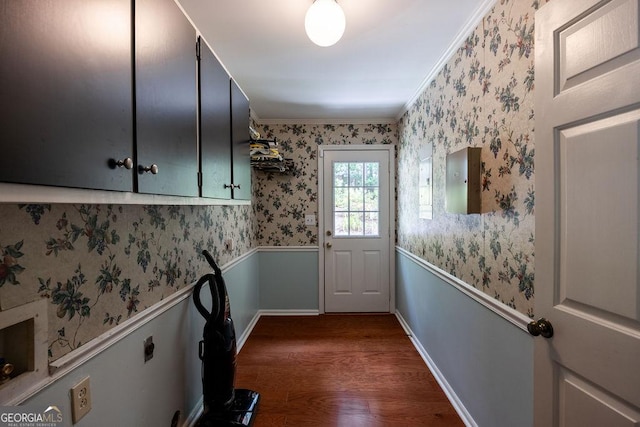 205 Castlegate Rd, Macon, GA 31210 - doorway to outside with dark wood finished floors, a wainscoted wall, crown molding, and wallpapered walls