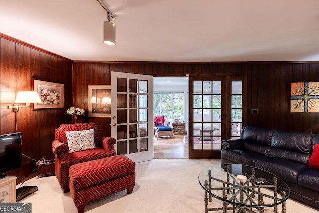 205 Castlegate Rd, Macon, GA 31210 - living room with french doors, wooden walls, light colored carpet, and track lighting