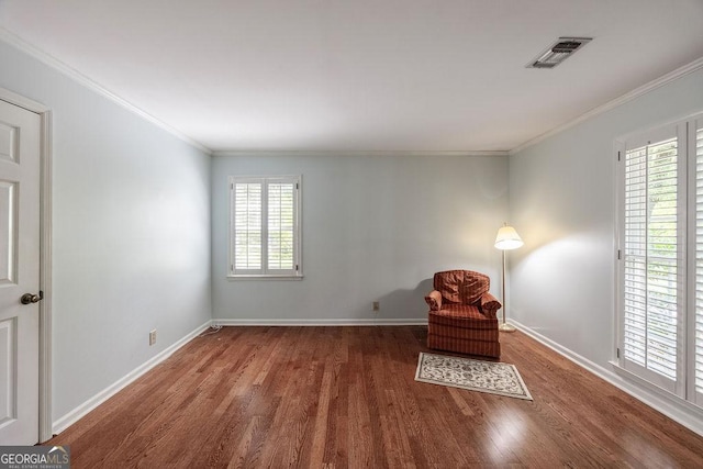 205 Castlegate Rd, Macon, GA 31210 - sitting room with wood finished floors, plenty of natural light, and crown molding
