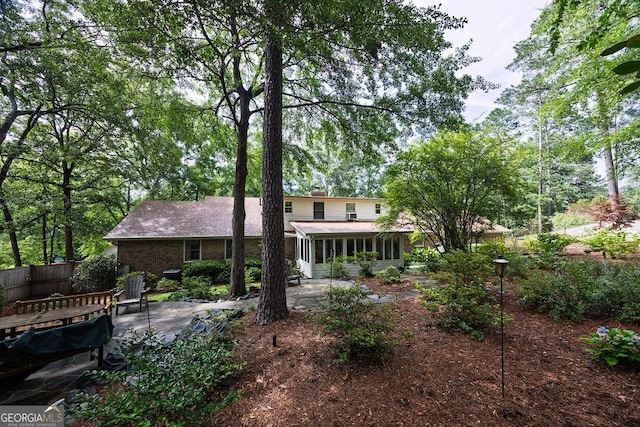 205 Castlegate Rd, Macon, GA 31210 - back of property featuring a sunroom and a patio