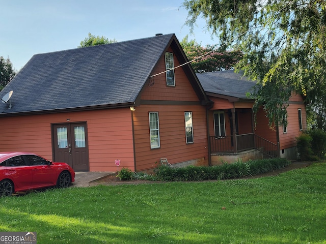 45 Oak Wood Ln, Covington, GA 30016 - view of home's exterior featuring a yard and roof with shingles