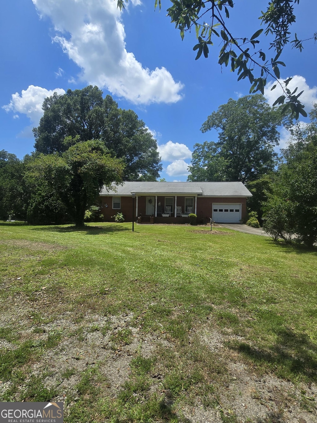 5061 Old Atlanta Rd, Hampton, GA 30228 - single story home featuring a garage and a front yard