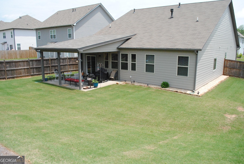 4605 Dandelion Way, Cumming, GA 30040 - back of house with roof with shingles, a patio area, and a fenced backyard