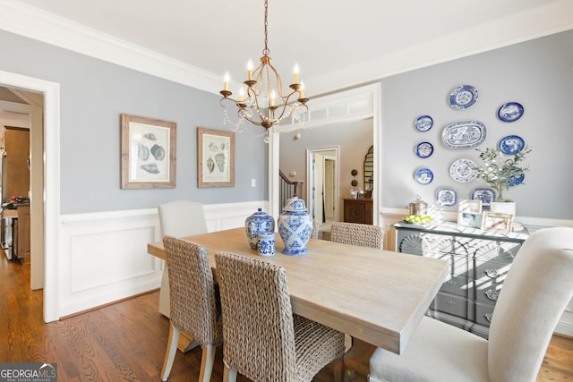 1030 Spring Lake Dr, Bishop, GA 30621 - dining space with a chandelier, a wainscoted wall, wood finished floors, and crown molding