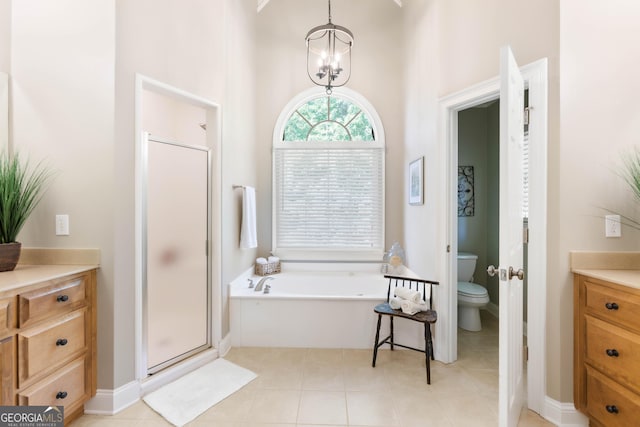 1030 Spring Lake Dr, Bishop, GA 30621 - bathroom featuring vanity, a bath, a stall shower, and a towering ceiling