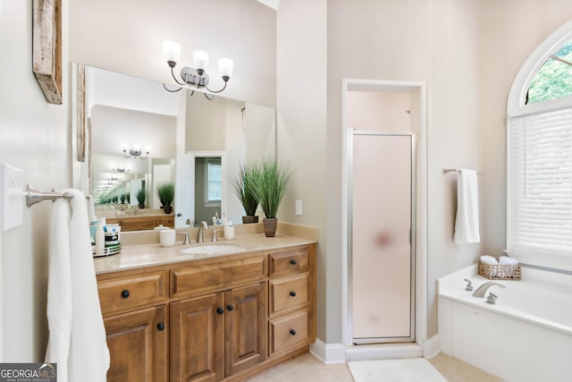 1030 Spring Lake Dr, Bishop, GA 30621 - full bath with a shower stall, vanity, a bath, tile patterned flooring, and a chandelier