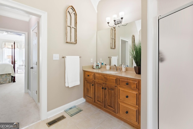 1030 Spring Lake Dr, Bishop, GA 30621 - ensuite bathroom with vanity, a chandelier, and tile patterned floors