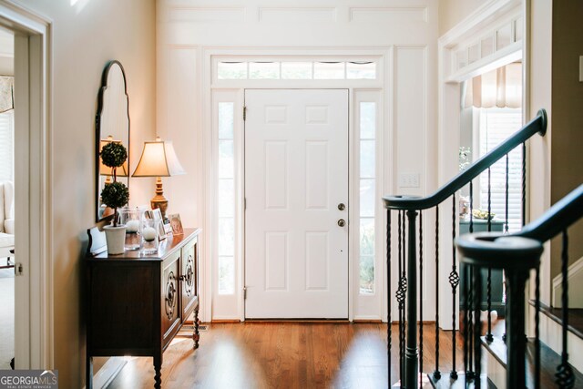 1030 Spring Lake Dr, Bishop, GA 30621 - entrance foyer featuring plenty of natural light, wood finished floors, and stairs