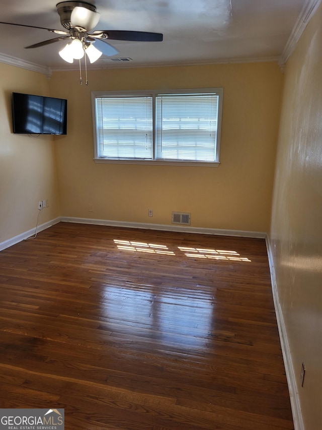 3211 Rockview Dr, Lithonia, GA 30038 - spare room with ornamental molding, ceiling fan, and wood finished floors