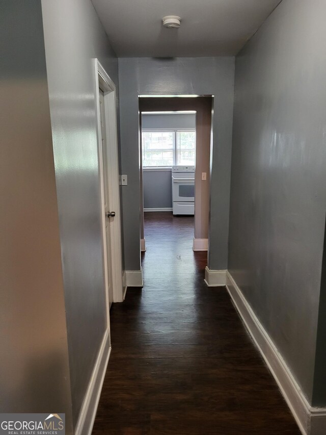 3211 Rockview Dr, Lithonia, GA 30038 - hallway featuring dark wood-style floors