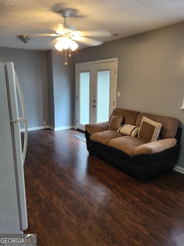 3211 Rockview Dr, Lithonia, GA 30038 - living room with wood finished floors, a ceiling fan, a textured ceiling, and french doors