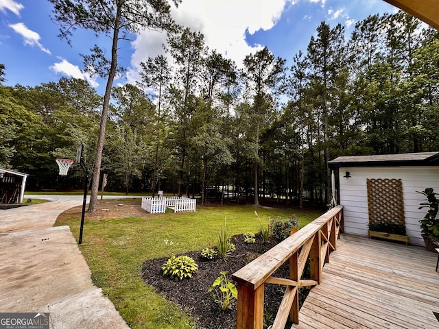 245 Clearwater Rd, Sharpsburg, GA 30277 - view of green lawn with a wooden deck and view of wooded area