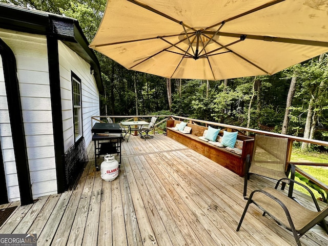 245 Clearwater Rd, Sharpsburg, GA 30277 - wooden terrace featuring an outdoor hangout area, outdoor dining space, and view of wooded area