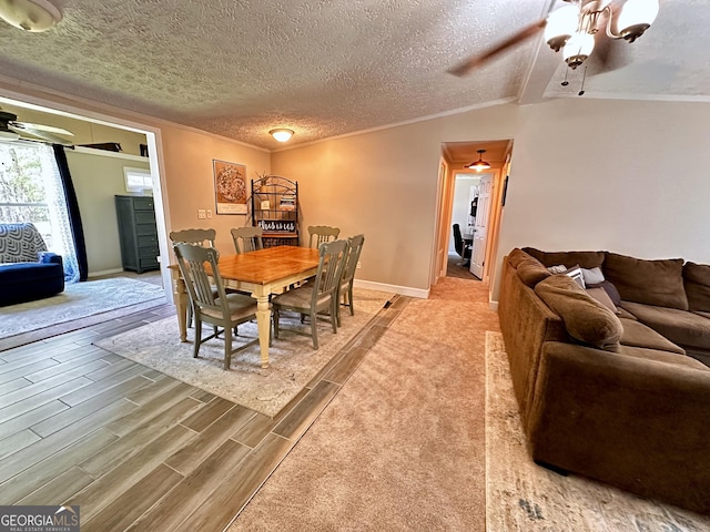 245 Clearwater Rd, Sharpsburg, GA 30277 - dining room with ceiling fan, ornamental molding, wood finished floors, and a textured ceiling