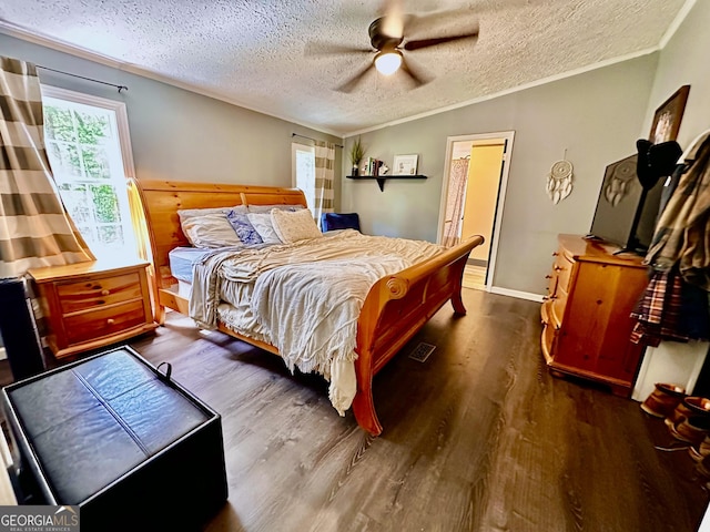 245 Clearwater Rd, Sharpsburg, GA 30277 - bedroom featuring wood finished floors, a textured ceiling, ornamental molding, and ceiling fan