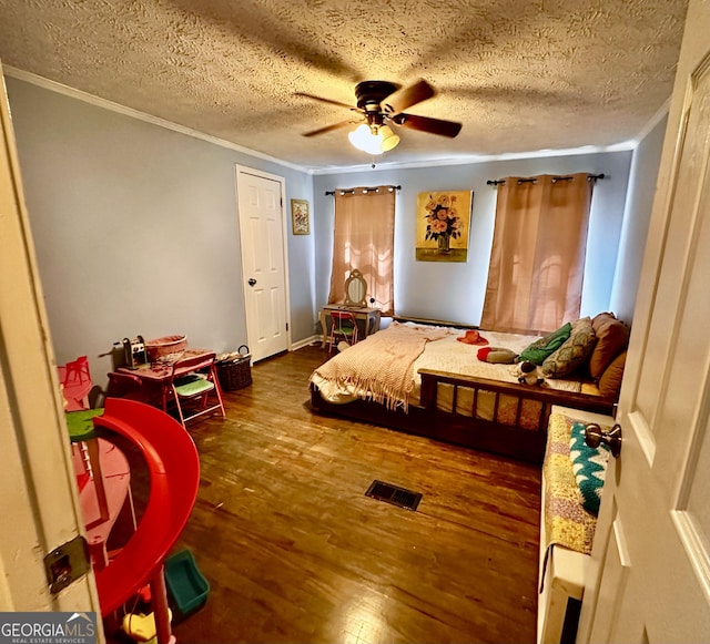 245 Clearwater Rd, Sharpsburg, GA 30277 - bedroom with crown molding, hardwood / wood-style floors, ceiling fan, and a textured ceiling