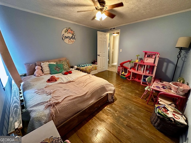 245 Clearwater Rd, Sharpsburg, GA 30277 - bedroom with wood finished floors, a textured ceiling, crown molding, and ceiling fan
