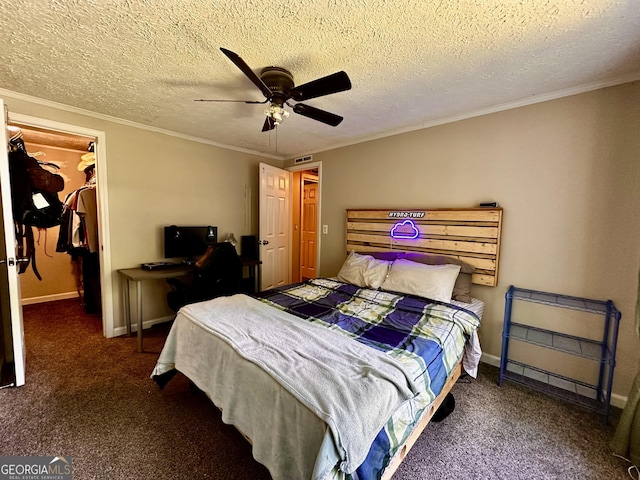 245 Clearwater Rd, Sharpsburg, GA 30277 - carpeted bedroom with ornamental molding, a spacious closet, a closet, ceiling fan, and a textured ceiling