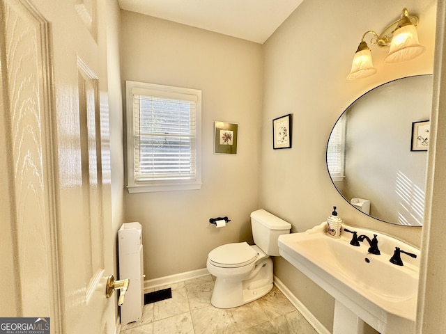 703 Overlook Pt, Woodstock, GA 30189 - bathroom with toilet and radiator heating unit