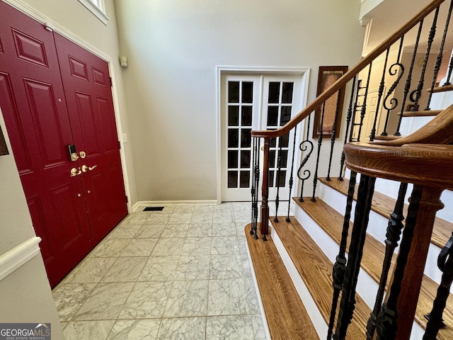 703 Overlook Pt, Woodstock, GA 30189 - entryway with stairway, marble finish floors, and a high ceiling