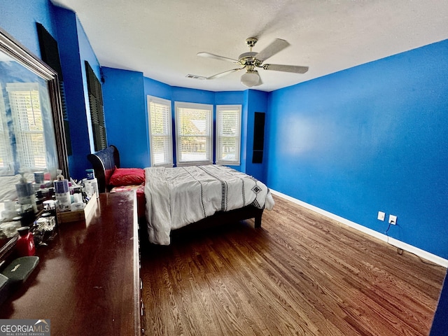 703 Overlook Pt, Woodstock, GA 30189 - bedroom featuring wood finished floors and ceiling fan