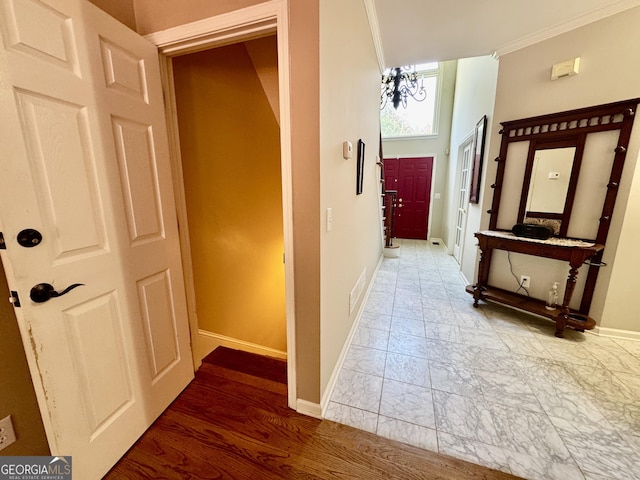 703 Overlook Pt, Woodstock, GA 30189 - hallway featuring crown molding and marble look tile flooring