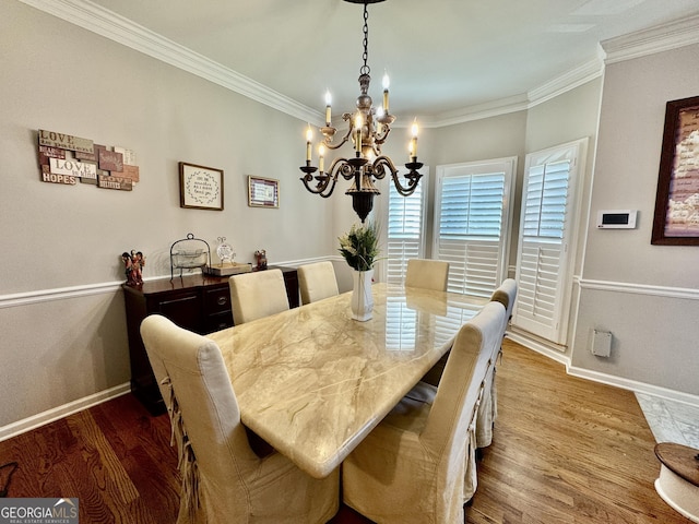 703 Overlook Pt, Woodstock, GA 30189 - dining area featuring a chandelier, crown molding, and wood finished floors