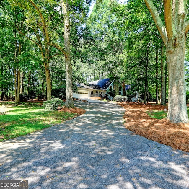 4393 Cannon Rd, Loganville, GA 30052 - view of front of house featuring asphalt driveway and a garage