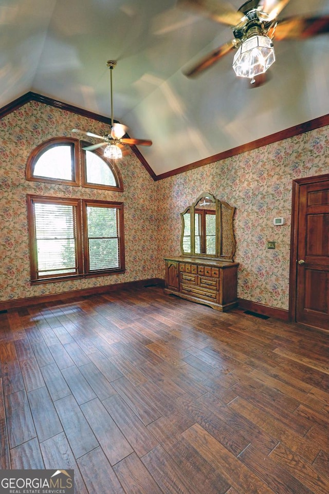 4393 Cannon Rd, Loganville, GA 30052 - unfurnished living room with ceiling fan, lofted ceiling, wallpapered walls, and dark wood-style floors