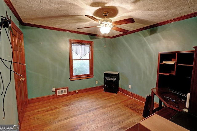 4393 Cannon Rd, Loganville, GA 30052 - unfurnished office with a textured ceiling, crown molding, wood finished floors, and ceiling fan