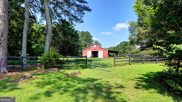 4393 Cannon Rd, Loganville, GA 30052 - view of yard featuring a pole building, an outdoor structure, and a gate