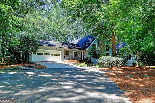4393 Cannon Rd, Loganville, GA 30052 - view of front facade featuring asphalt driveway and a garage