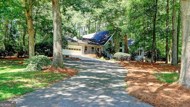 4393 Cannon Rd, Loganville, GA 30052 - view of front facade with driveway and an attached garage