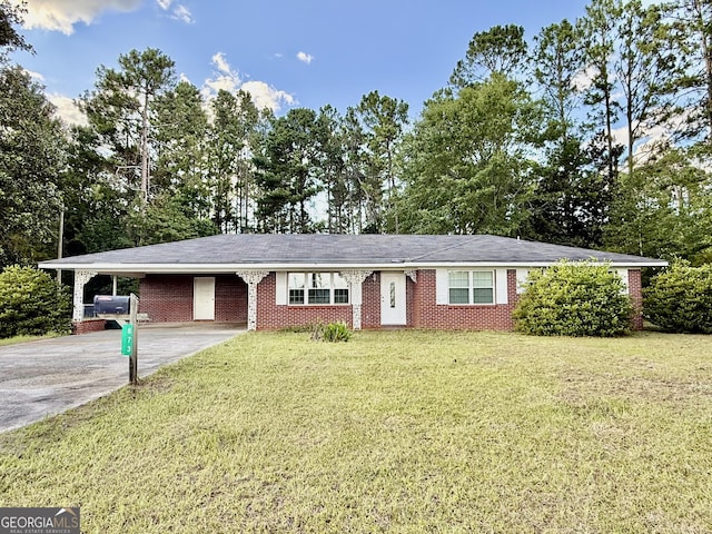 873 US Highway 280, Claxton, GA 30417 - ranch-style house featuring concrete driveway, an attached carport, a front yard, and view of wooded area
