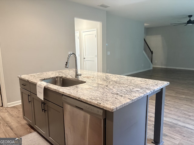 248 Webster Lake Dr, Temple, GA 30179 - kitchen with dishwasher, ceiling fan, light wood finished floors, open floor plan, and an island with sink