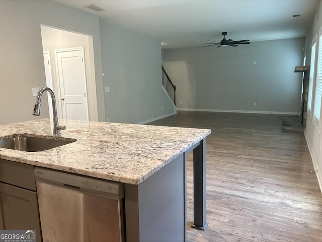 248 Webster Lake Dr, Temple, GA 30179 - kitchen with dishwasher, a ceiling fan, wood finished floors, and light stone counters