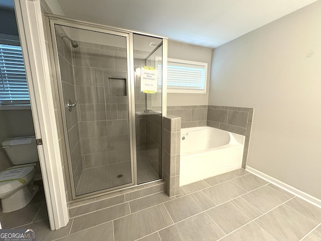 248 Webster Lake Dr, Temple, GA 30179 - full bathroom with a bath, a shower stall, and tile patterned flooring