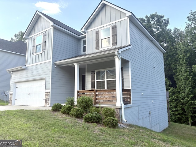 248 Webster Lake Dr, Temple, GA 30179 - view of front of home featuring a porch, board and batten siding, stone siding, an attached garage, and a front lawn